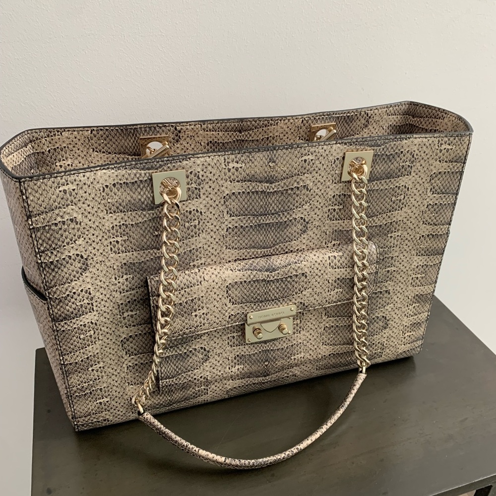 Henri Bendel shoulder bag. Snake skin pattern with gold hardware.
